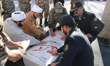 برگزاری محفل انس با قرآن و غبار روبی مزار شهدا در منطقه پدافند هوایی شمال غرب